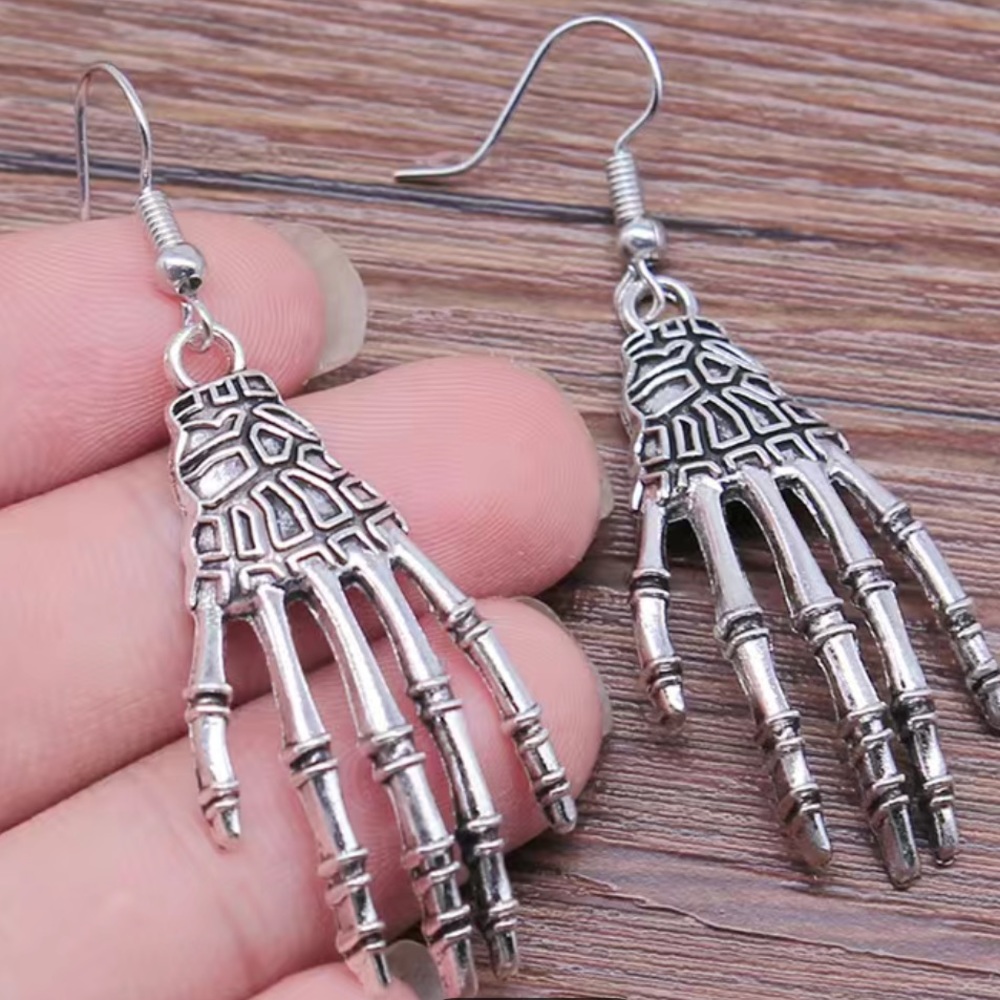 NIP skeleton hand earrings